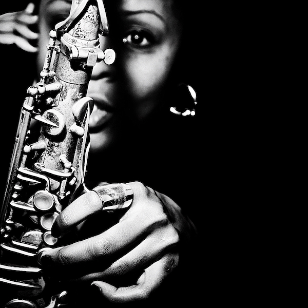 Black and white photo of Matana Roberts with saxophone
